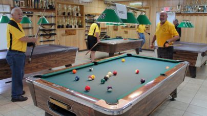 Adult men playing Billiards