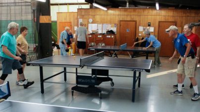 senior friends playing table tennis