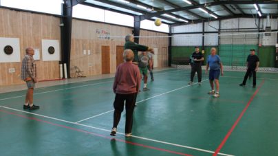 adults playing volleyball